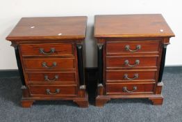 A pair of mahogany four drawer bedside chests with pillar column supports