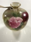 A Royal Worcester bulbous pot, with hand painted rose decoration,