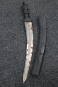 An African sword in leather scabbard