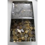 An early 20th century FREARS biscuit tin containing foreign coins