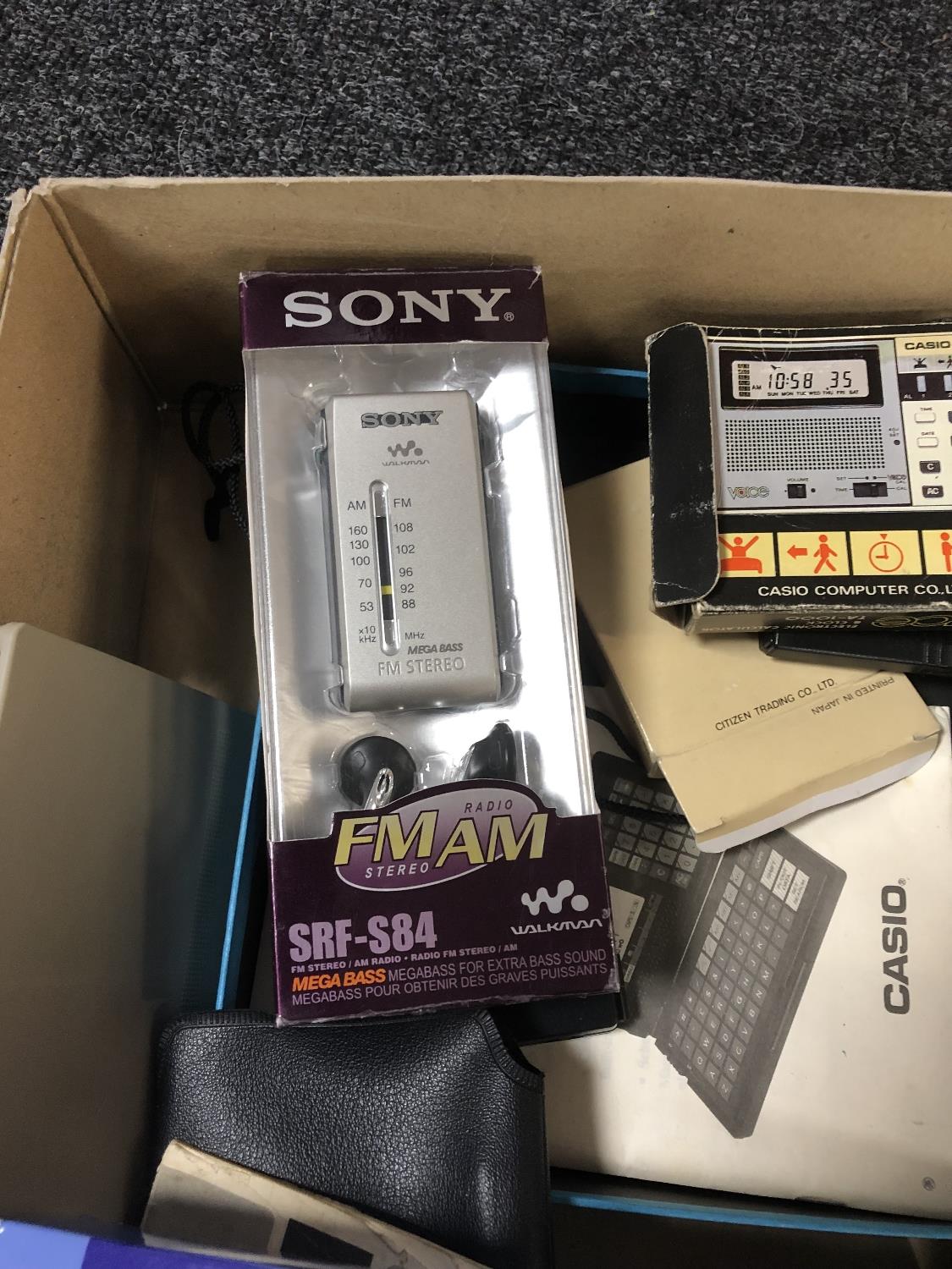 A box of Sony Walkman, Sony FM radio, Casio digital diary, calculators, - Image 6 of 6