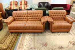 A twentieth century Danish brown buttoned leather three piece suite comprising of three seater