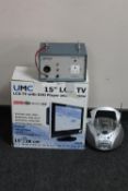 A boxed UMC 15 inch LCD TV with DVD,