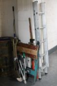A set of extending aluminium ladders together with a folding black and decker work mate and