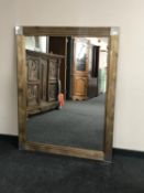 A contemporary overmantel mirror 110 cm x 140 cm