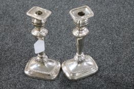 A pair silver plated on copper Dan Holy candlesticks