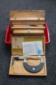 A basket of five cased micro metre calipers