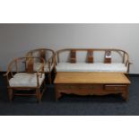 A Chinese four piece lounge suite comprising three seater settee,
