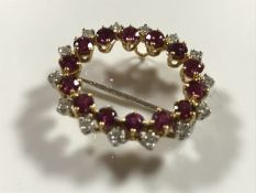 An 18ct gold ruby and diamond brooch, approximately 1.5ct, 7.2g.