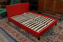A red leather 5' bed frame