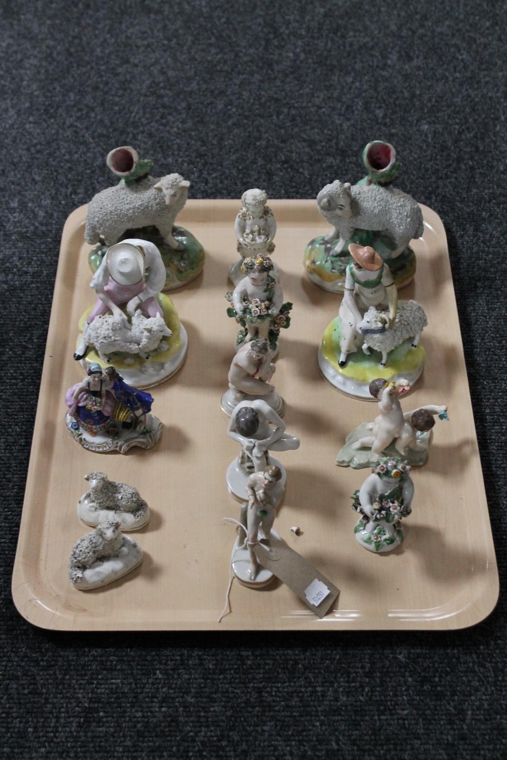A tray of nine continental figurines,