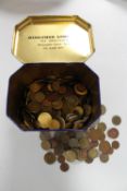 A QE II Ringtons commemorative tin containing early 20th century and later foreign coins