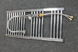 A chrome bathroom towel rail,