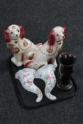 A tray of wooden goblet souvenir from Pitcarn Island, pair of Staffordshire style dogs,