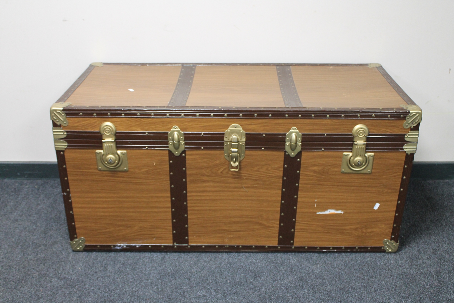 A mid twentieth century metal bound trunk