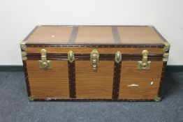 A mid twentieth century metal bound trunk