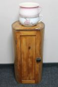 An antique cylindrical pine pot cupboard and two chamber pots