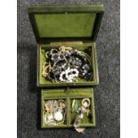 A box of costume jewellery, wristwatch, brooches etc.