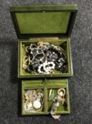 A box of costume jewellery, wristwatch, brooches etc.