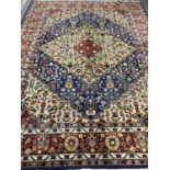 A fringed Persian woolen carpet on blue ground,