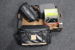 A box of portable DVD player in case, Hitachi video camera, tin of heart monitor,