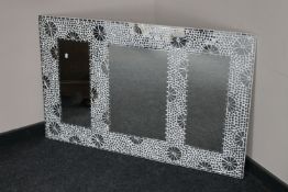 A frameless mosaic mirror