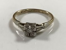 An early twentieth century diamond set 9ct and palladium mounted ring, 1.6g, size K.