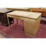 A twentieth century oak single pedestal desk with two drawers