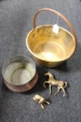 A vintage brass jam pan with cast iron handle together with a copper embossed planter and two brass