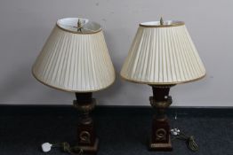 A pair of classical style table lamps with shades