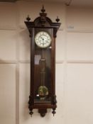 A good quality reproduction Vienna wall clock, with pendulum and key,