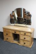 An antique pine sideboard fitted with a triple dressing table mirror