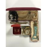 A box of costume jewellery to include Russian wrist watch face, Queen Star lighter, cufflinks,