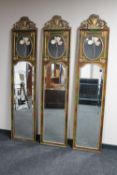 Three contemporary gilt mirrored wall panels