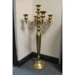 A heavy brass five way floor standing candelabrum