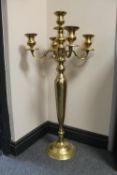 A heavy brass five way floor standing candelabrum