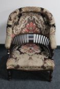 A Victorian mahogany tub chair in floral brocade