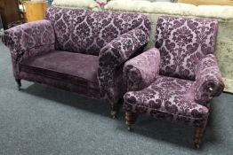 A Victorian drop end settee and matching chair in purple brocade fabric