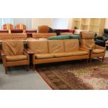 A three piece mid twentieth century brown leather lounge suite