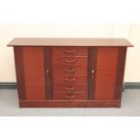 A late twentieth century sideboard in a mahogany finish