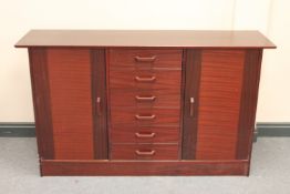 A late twentieth century sideboard in a mahogany finish