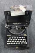 A vintage cased Remington home portable typewriter