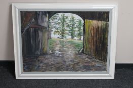 A 20th century framed oil on board - view from a barn,