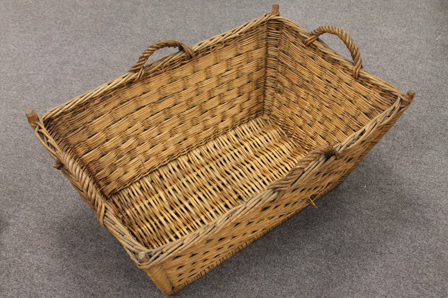 A mid twentieth century wicker log basket