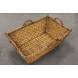 A mid twentieth century wicker log basket