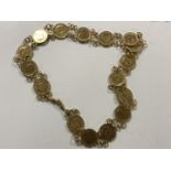 A mid twentieth century gilded half penny necklace