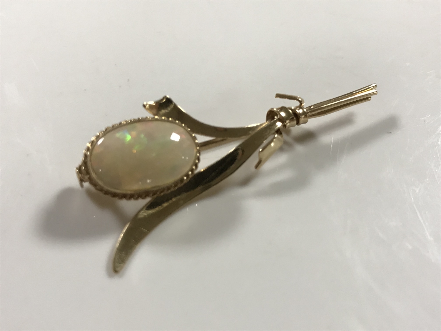 A 10ct gold opal brooch modelled as a flower bud, 3.9g.