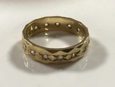 A 9ct gold diamond set eternity ring, 4.2g, size M.
