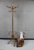 A bentwood hat and coat stand together with a D-shaped two tier side table and an enamelled water