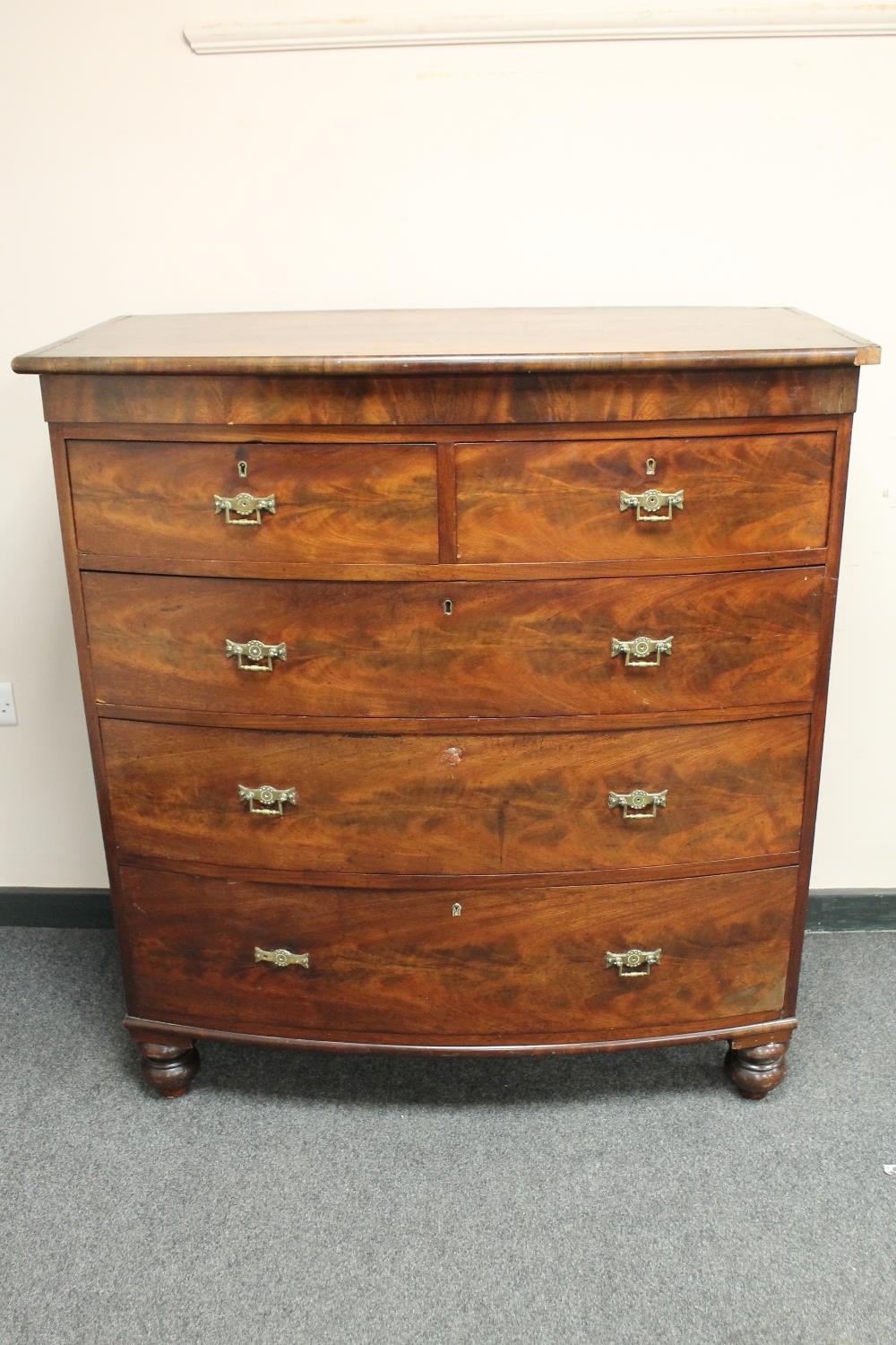 A Victorian mahogany bow-fronted five drawer chest,